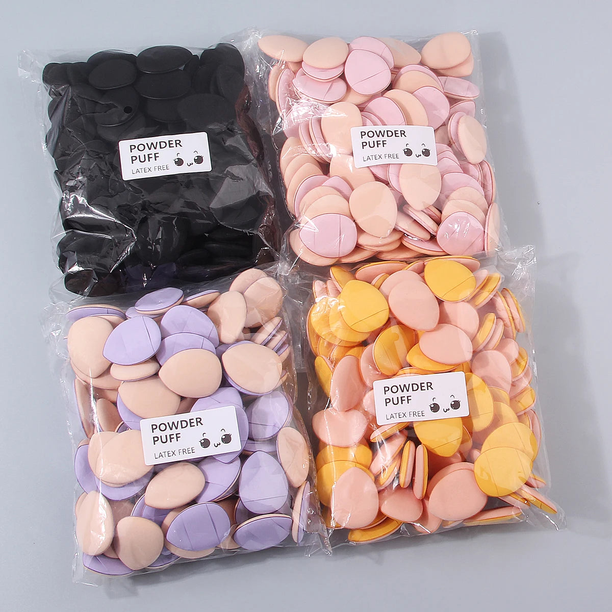 100PCS Super affordable and portable makeup thumb set, teardrop-shaped dry and wet dual-purpose non-stick mini powder puff